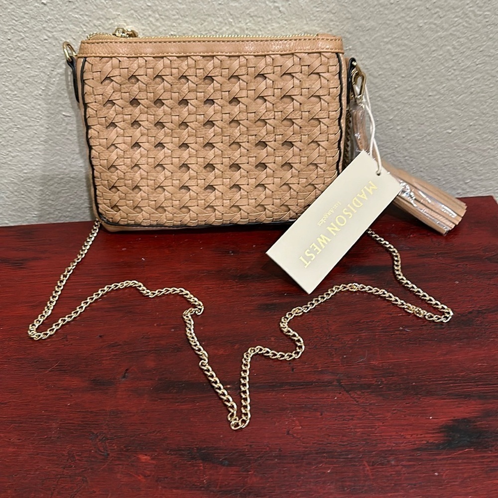 NWT Madison West purse with tassel. Has one compartment. Has gold chain.